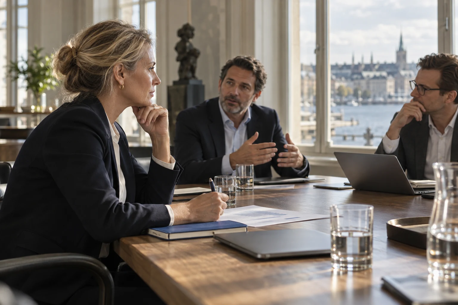 Finance and technology colleagues discussing an investment decision.